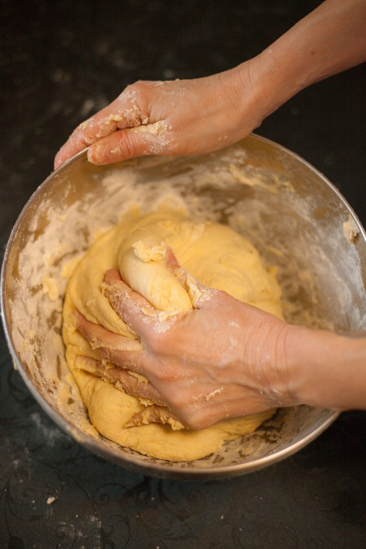 Aus Care Community Services | Local NDIS Providers | Home Hands kneading dough in a mixing bowl on a kitchen bench