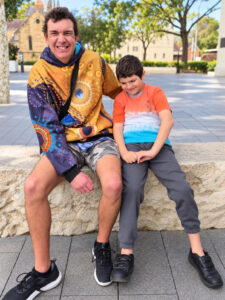 Aus Care Community Services | Local NDIS Providers | Home Two brothers smiling together on a community outing